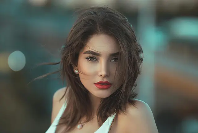 brunette-model-woman-looking-at-camera-with-olive-features-modeling-hair-640x430